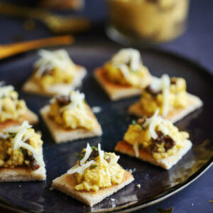 Scrambled eggs on toast with morels and Tome du Lomont